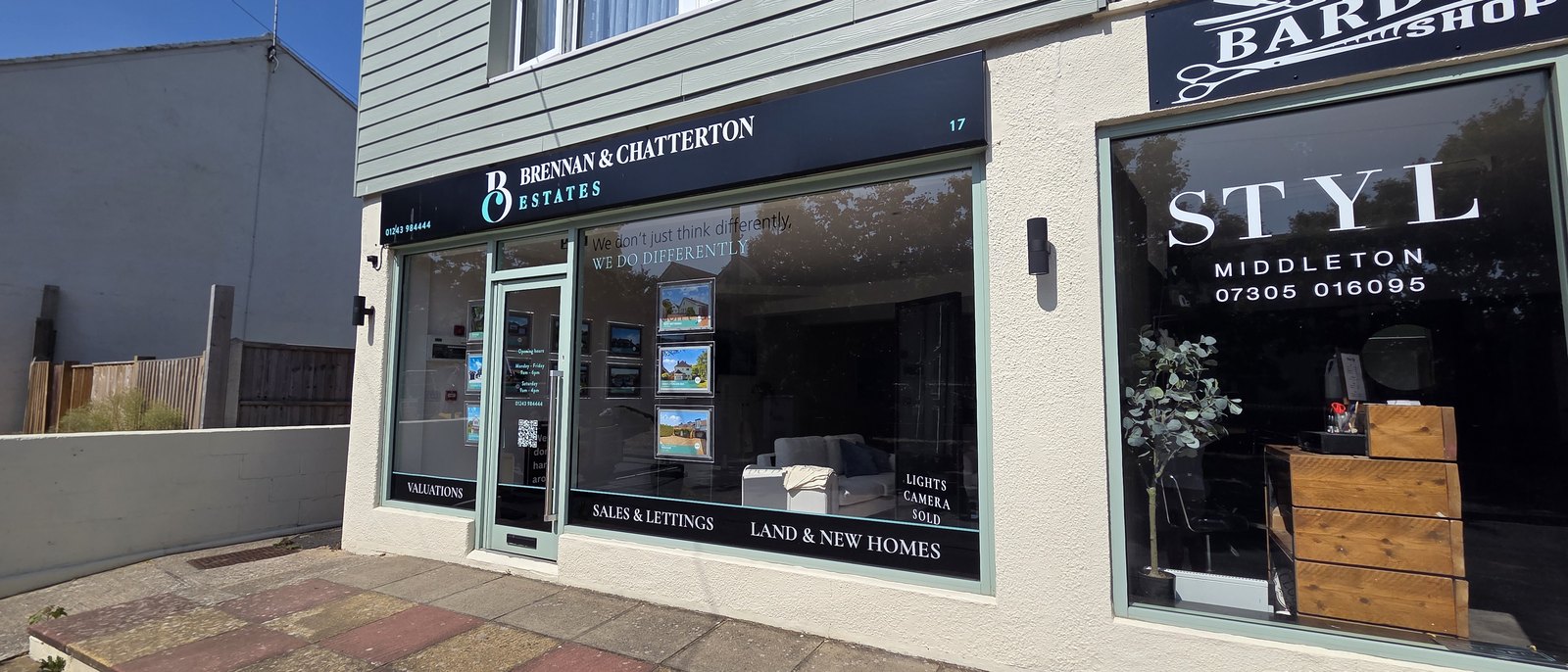 Two shopfronts side by side: Brennan and Chatterton Estates with property details in the window, and STYL Middleton, a barber shop